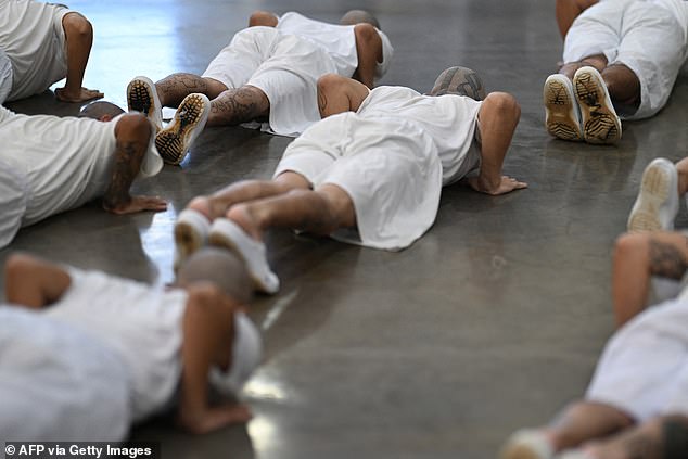 Inmates bent on the ground. The huge facility was inaugurated two years ago under the government of President Nayib Bukele
