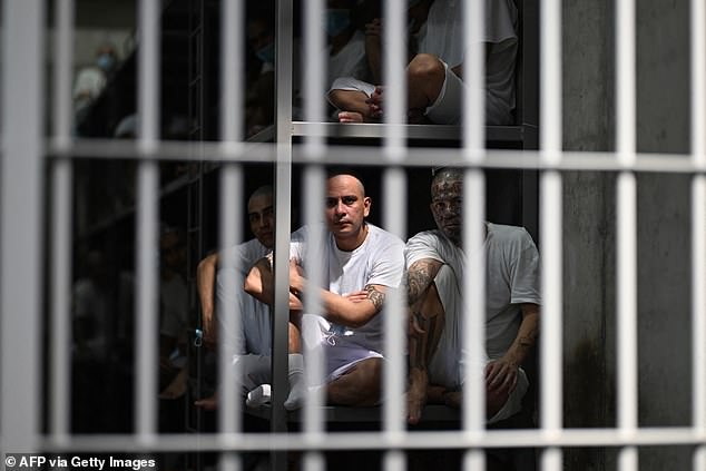 Prisoners are permitted to speak only in whispers, with conversations forbidden with the sinister-looking guards