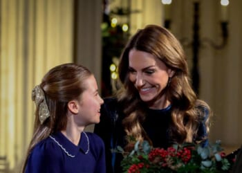 Sweet moment Charlotte gazes up at mum Kate as they play piano side-by-side to kick off Christmas Eve carol concert