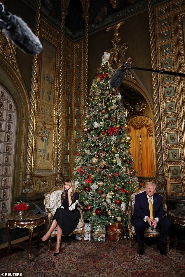 U.S. President Donald Trump and first lady Melania Trump participate in NORAD Santa tracker phone calls, on Christmas Eve, from the Mar-a-lago club in Palm Beach, Florida, U.S., December 24, 2025