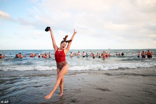 This swimmer celebrating while many swimmers braved the conditions