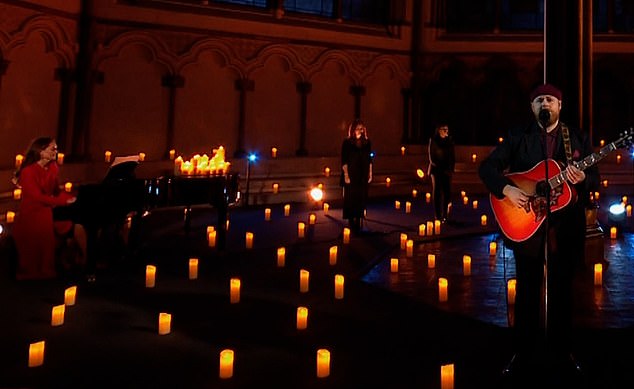 Kate, pictured, far left, and Tom Walker, right, gave an emotional performance by candlelight at Westminster Abbey in 2021