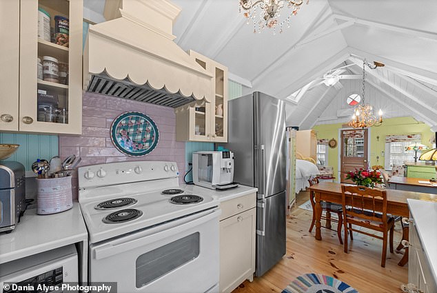 The kitchen, which already comes with a stove, also features backyard access through a back door