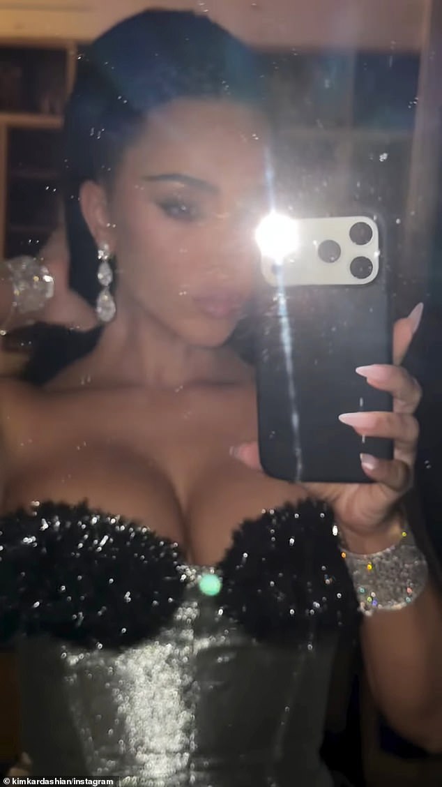 Kim snapped a picture in the reflection of a mirror after slipping into the look before also sharing short clips as she modeled the Mugler outfit