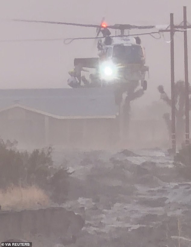 As flood conditions worsened in San Bernardino County, officials elevated an evacuation warning  to a shelter-in-place