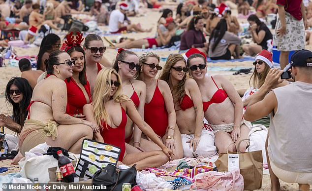 Red swimming costumes were the dominant theme along Australian coastlines on Thursday