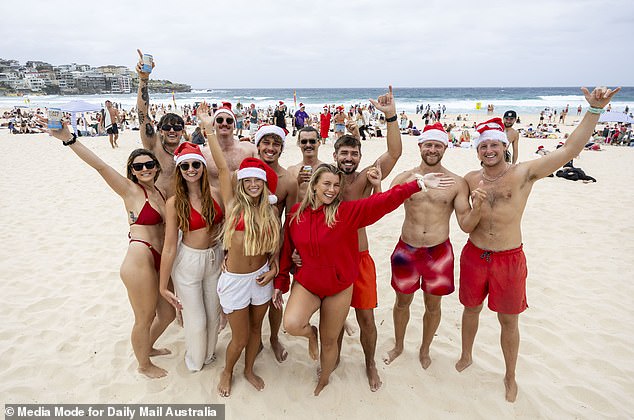 Red swimwear and Santa hats were all the rage along the beach