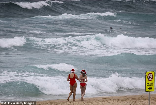 Fewer beachgoers braved the waves this year as skies remained grey
