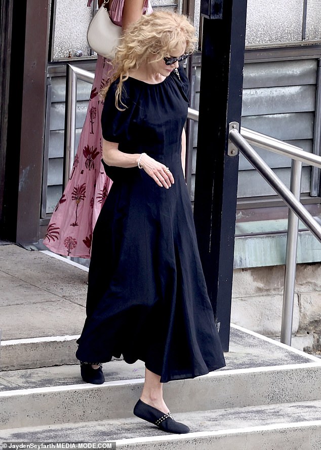 Carrying a black handbag and wearing only simple jewellery, Nicole appeared subdued as she arrived for the service, her expression calm yet reflective