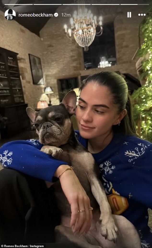 She donned a festive Christmas jumper as she enjoyed the cosy night with the Beckhams