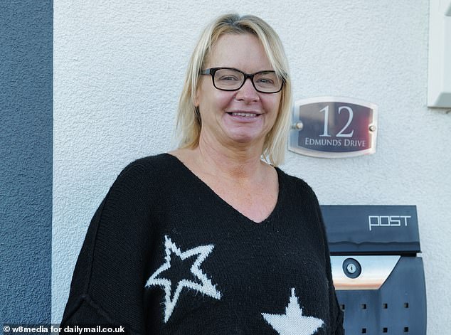 Rachael Barron, (pictured) who lives in a customizable pre-built home opposite laughed when speaking about the blue house