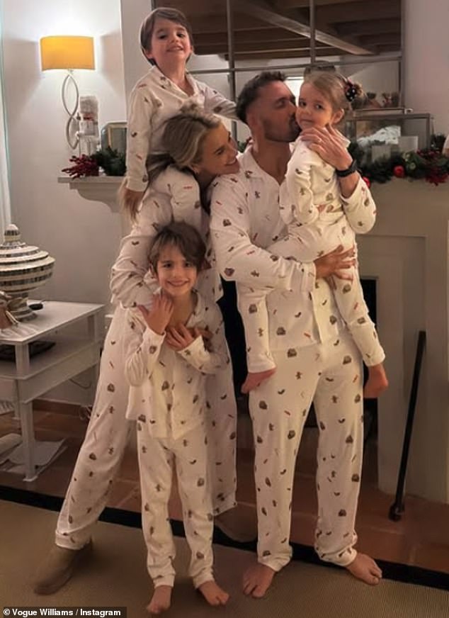 The family's stylish white sleepwear were embellished with festive candy canes and gingerbread men