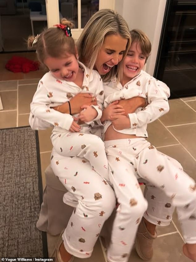 The family's stylish white sleepwear were embellished with festive candy canes and gingerbread men, before later changing into equally eye-catching red looks