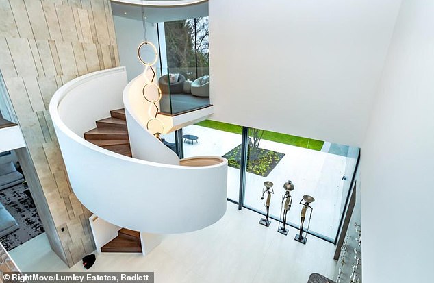 This ultra modern home is equipped with Crestron Home Automation, Lutron Lighting, automated blinds and curtains, security systems, and more