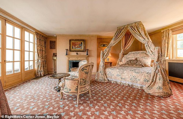 There is a library and three different gardens in the home as well as two separate kitchens