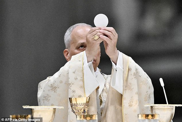 Pope Leo XIV performs the Christmas mass at St Peter's Basilica in the Vatican on December 25, 2025