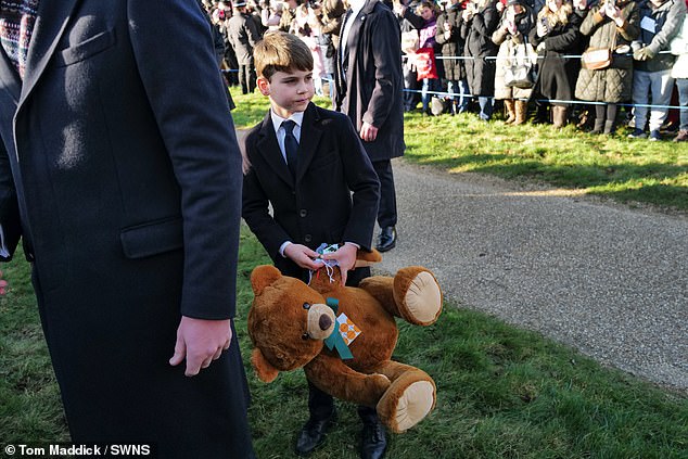 The cheeky young royal was also seen carrying a giant stuffed teddy bear