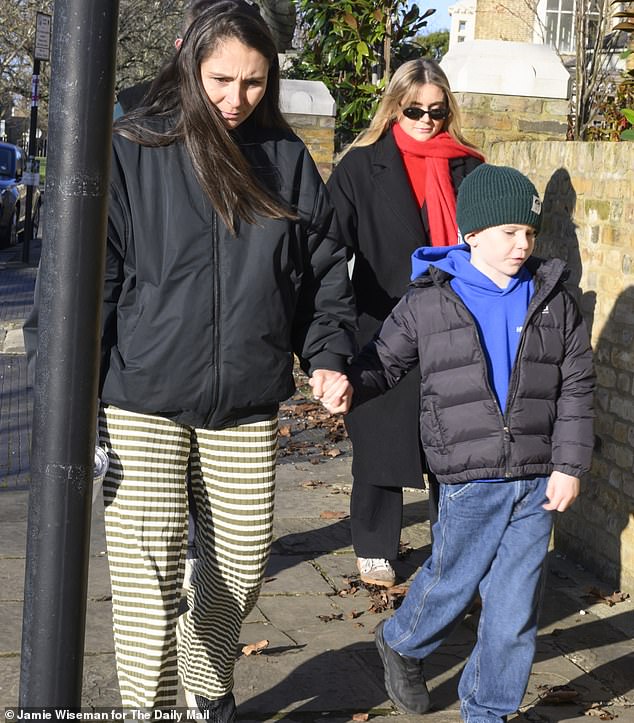The family were out in force on Christmas Day (Tana and Gordon's son Oscar, six, is pictured)