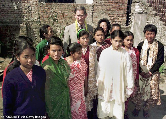 The then-prince of wales visits the Maiti Nepal Refuge Home in 1998
