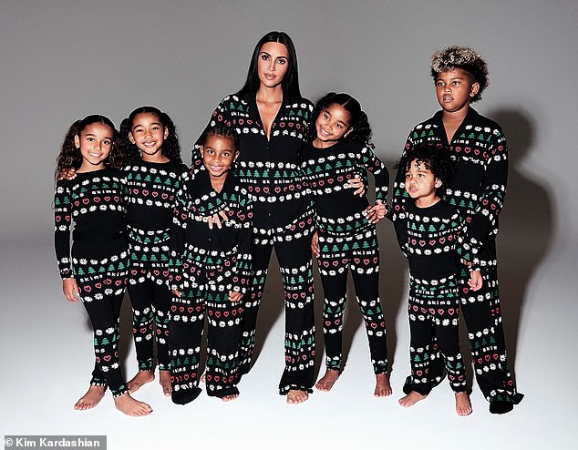 Kim Kardashian ushered in the festive season with a heartwarming Christmas Eve post featuring her kids and several of her nieces and nephews dressed in matching pajamas