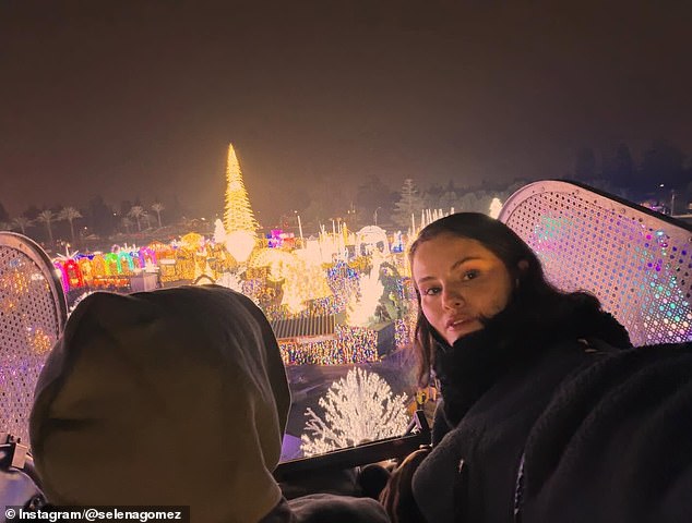 In one selfie, Gomez, 33, gazed softly into the camera while standing inside a light-covered passageway