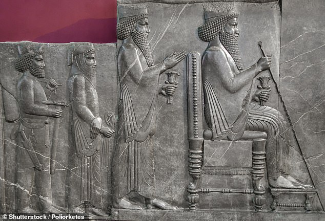 A carving from Persepolis shows King Darius on the throne with Xerxes standing behind him and a magi behind Xerxes