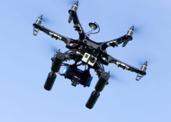 Gangs raking in £50,000-a-time by flying drones packed with phones, drugs and takeaways into prison