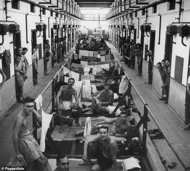 Photograph from 1945 shows Allied prisoners in overcrowded and squalid conditions at Changi Prison, Singapore