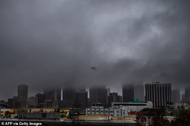 Heavy rain and clouds cover downtown Los Angeles, as seen from Echo Park