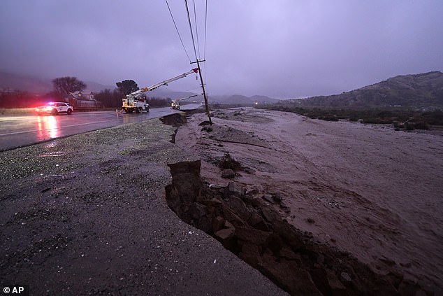 Damage is seen to a closed California State Route 138 after flooding washed part of the road away