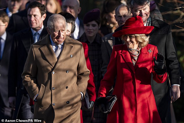 More than 500 well-wishers had gathered to catch a glimpse of the family, who were led by a beaming Charles. He was accompanied by Queen Camilla, bringing festive cheer in a striking red coat and hat. Pictured: The King and Queen leading the Christmas Day party