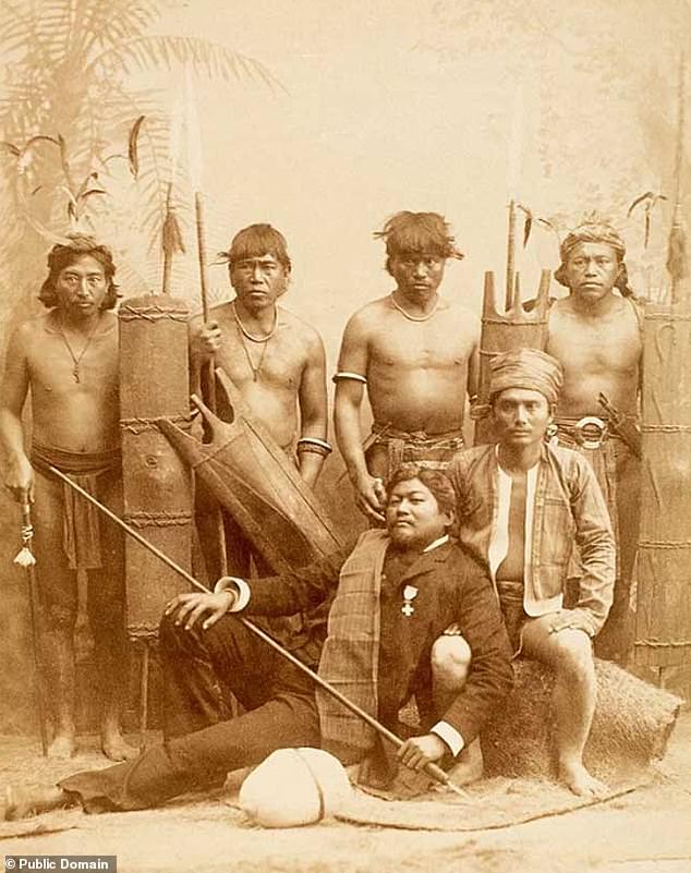 Filipino natives pose for a photograph in 1887 after they were brought over to Madrid to take part in a 'human zoo'
