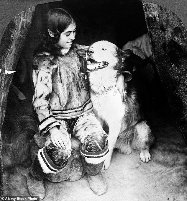 This Inuit girl, pictured with a girl, was born at World's Fair in Chicago. She was transferred to World's Fair, St. Louis in 1904