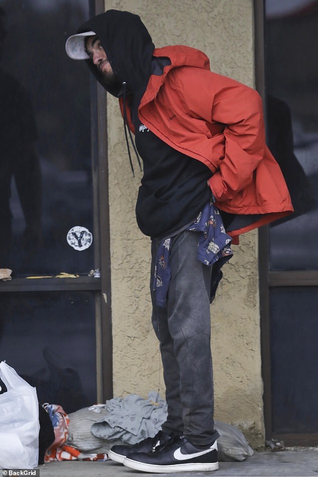 As Chase hunched forward, the man placed his hands on his shoulder and back and prayed for God to 'release the demonic activity' and to 'take him out of the darkness'