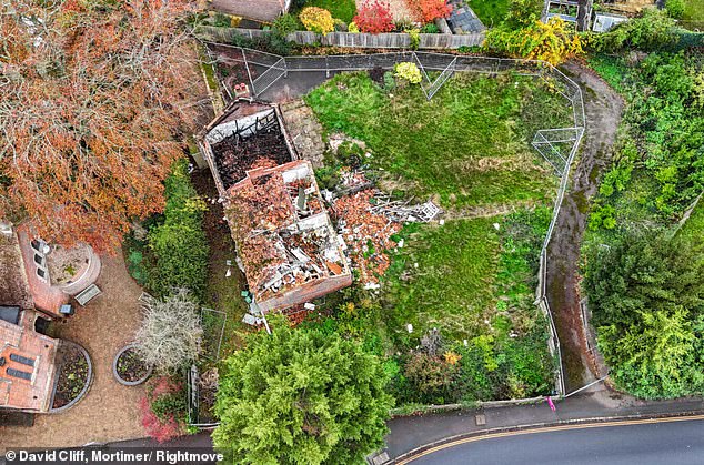 Listed for almost £500,000, the building currently stands as little more than a fire-ravaged shell. The house suffered 'sustained storm and fire damage', according to the estate agents