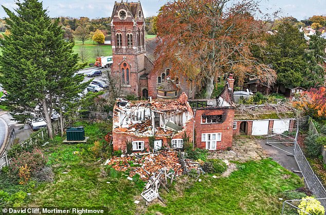 The once-grand period home, which backs onto a historic village church, has been left a wreck