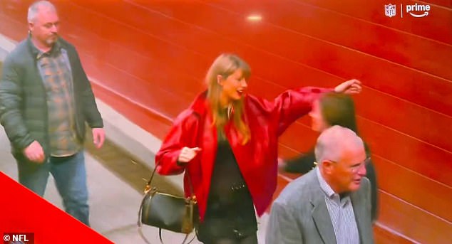 Swift was captured making her way inside the stadium where she greeted a woman with a hug