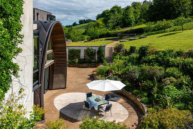 The property is built on 2.5 acres within a valley of South Downs National Park, near Petersfield, Hampshire