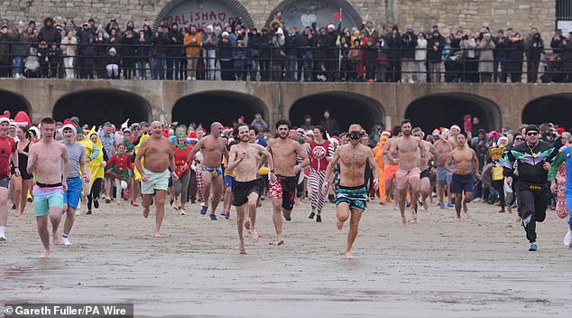 Swimmers were also out in force at Sunny Sands Beach in Folkestone, Kent, on Boxing Day
