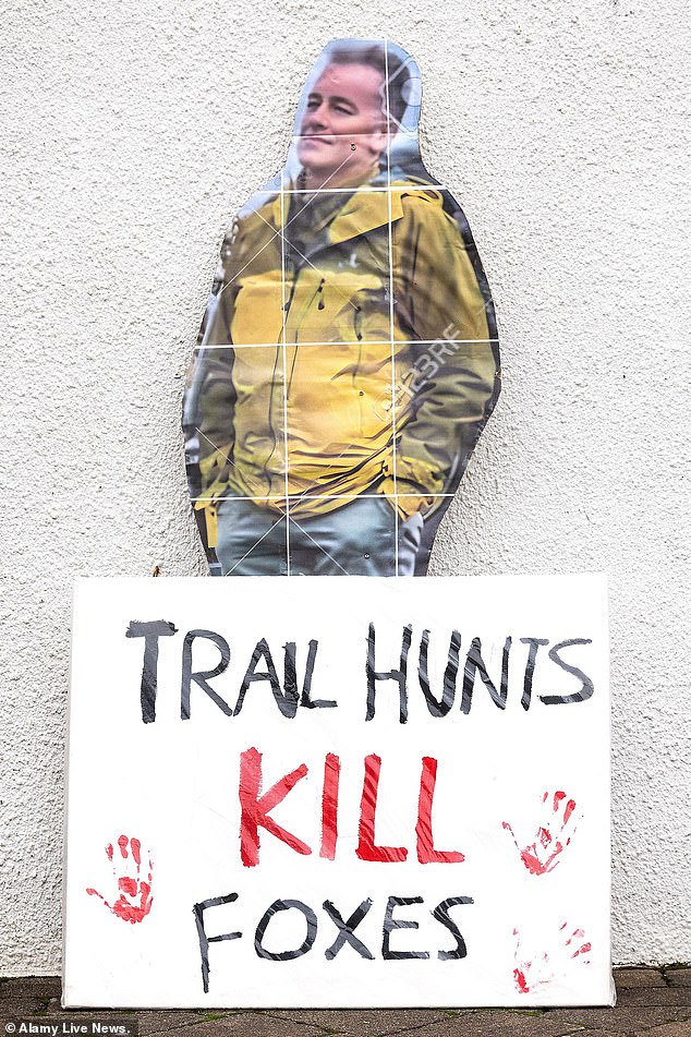 Hunt supporters brandished a cardboard cut-out of Chris Packham as they attended the Tiverton meet