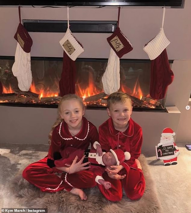 Kym shared a picture of Emilie’s son Teddy, six, and Emilie’s husband’s daughter Polly, nine, she wrote: 'Well what a wonderful Christmas gift this is!! Welcome to the world Bobby Saint Mykola Hoszowskyj!!! He’s so beautiful!'