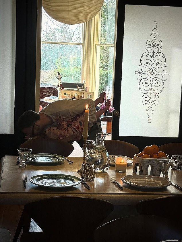 Stacey Dooley photographed her partner Kevin Clifton in a sweet moment with their daughter Minnie on Christmas