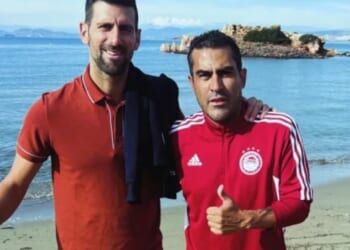 Ex-Prem ace who now sells fishing gear to tourists on beach snaps pic with Novak Djokovic