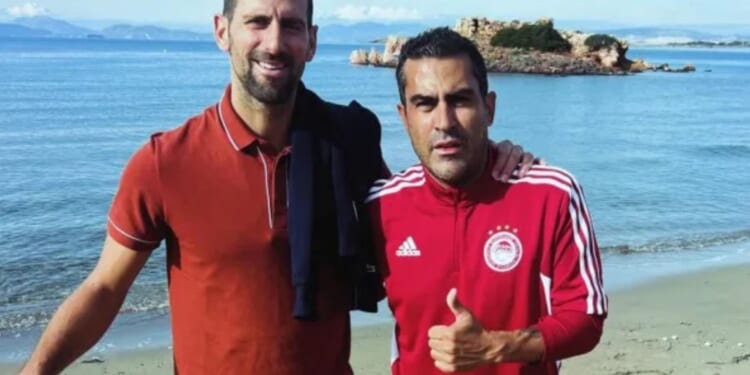 Ex-Prem ace who now sells fishing gear to tourists on beach snaps pic with Novak Djokovic