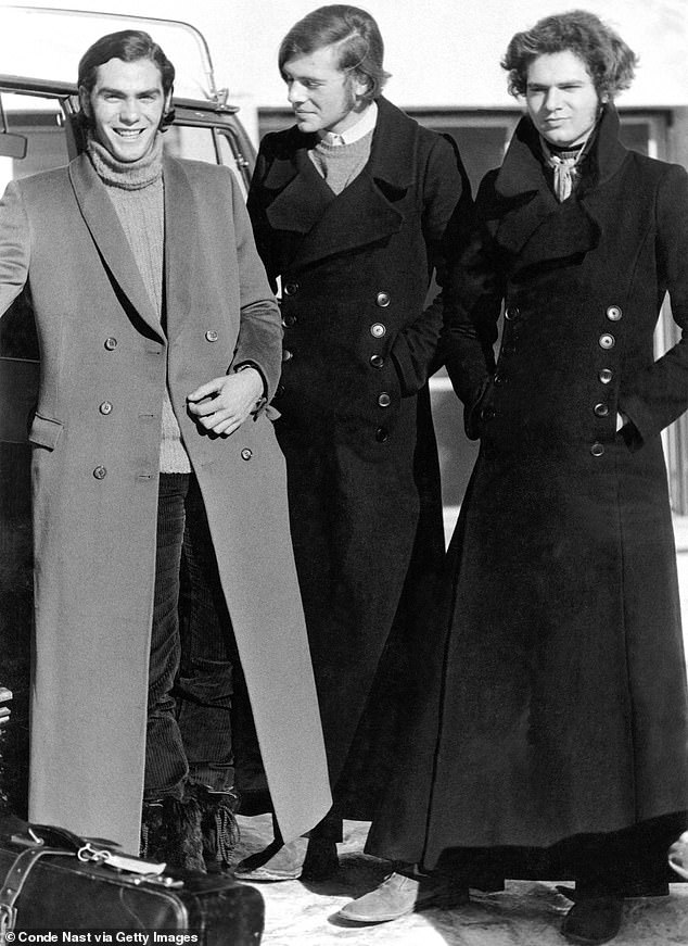 Three boys from the prestigious boy school, Le Rosey, in Gstaad, Switzerland, wearing maxicoats acquired in London