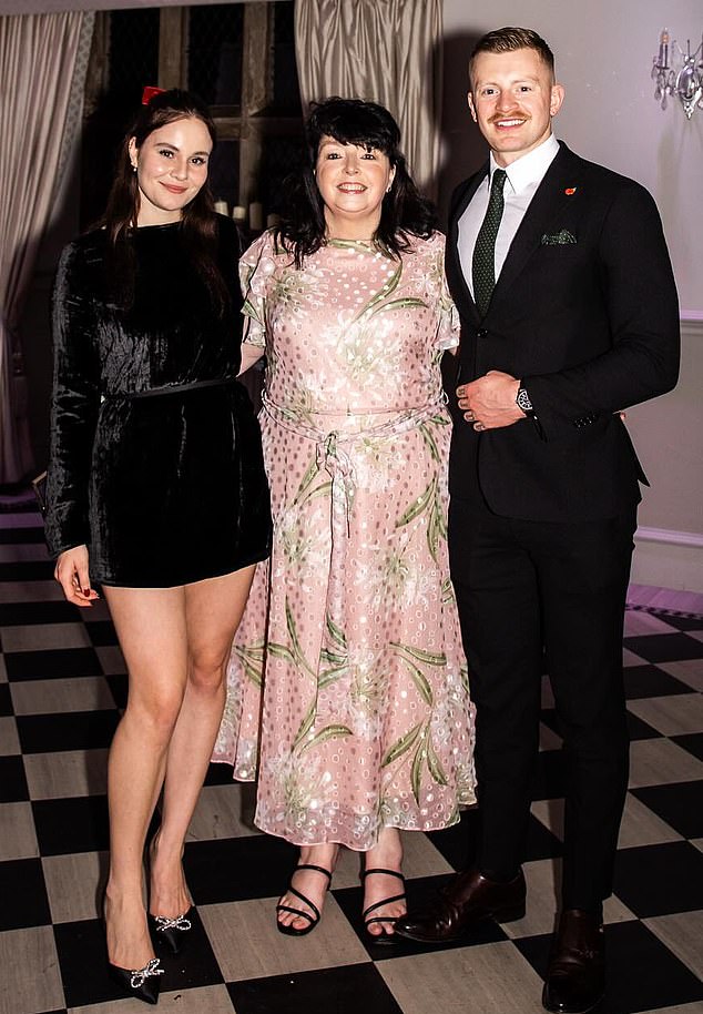 Holly, Caroline and Adam pose for a picture for an event that was posted to Adam's Instagram last year