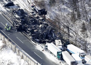 Horror as massive 50-vehicle pile-up kills at least two & sparks huge fire as shocking pics show devastating aftermath