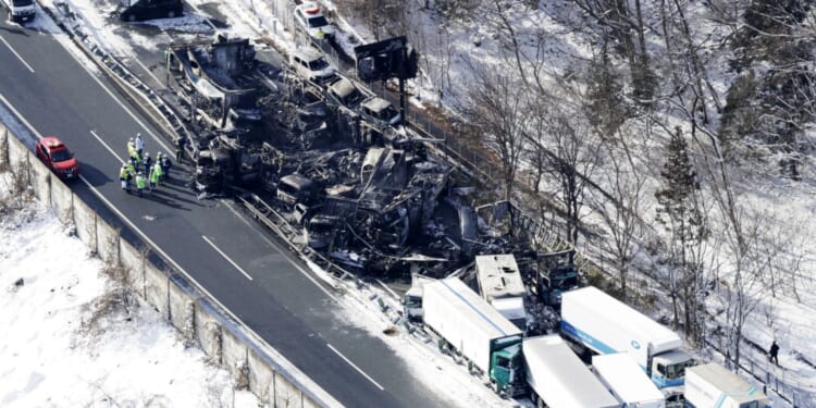 Horror as massive 50-vehicle pile-up kills at least two & sparks huge fire as shocking pics show devastating aftermath