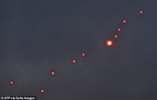 This photograph taken on December 27, 2025 shows Ukrainian air defence firing at drones during a Russian drones and missiles attack, in Kyiv, amid the Russian invasion in Ukraine