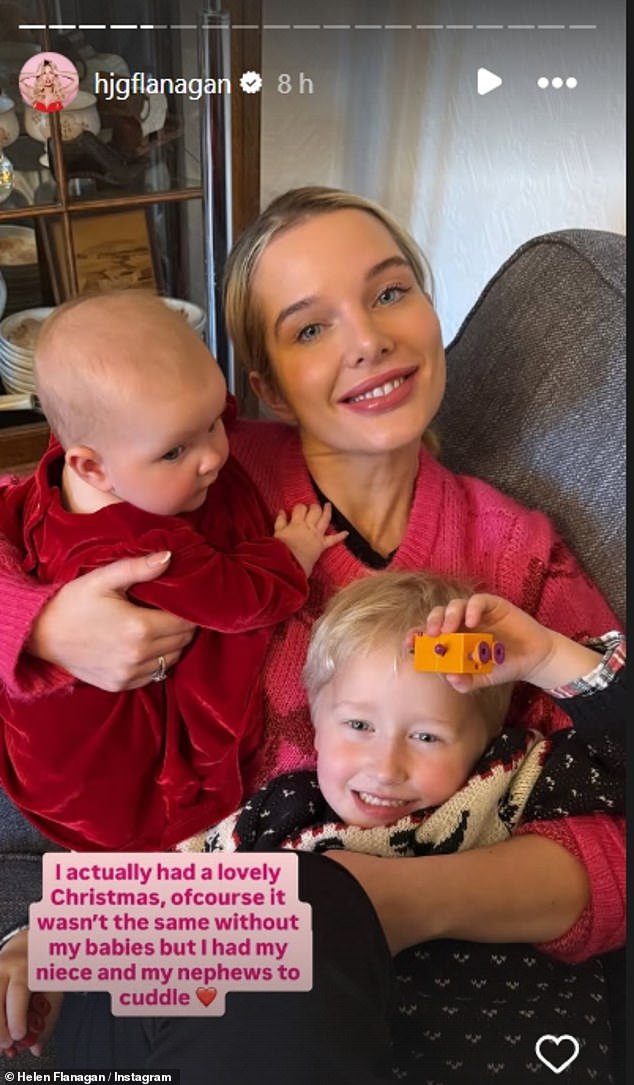 She also shared a heartwarming snap hugging her niece and nephew, writing: 'I actually had a lovely Christmas, of course it wasn't the same without my babies but I had my niece and my nephews to cuddle'